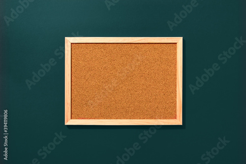 Empty coark board on green tidewater background