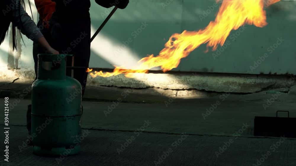 Man teaches how to use carbon dioxide (CO2) fire extinguishers to