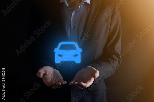 Digital composite of Man holding car icon.Car automobile insurance and car services concept. Businessman with offering gesture and icon of car.