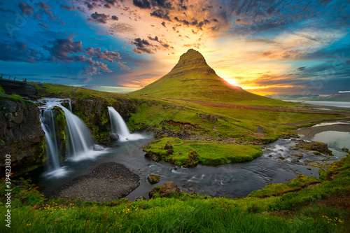 Sunset waterfall with big stones in Iceland