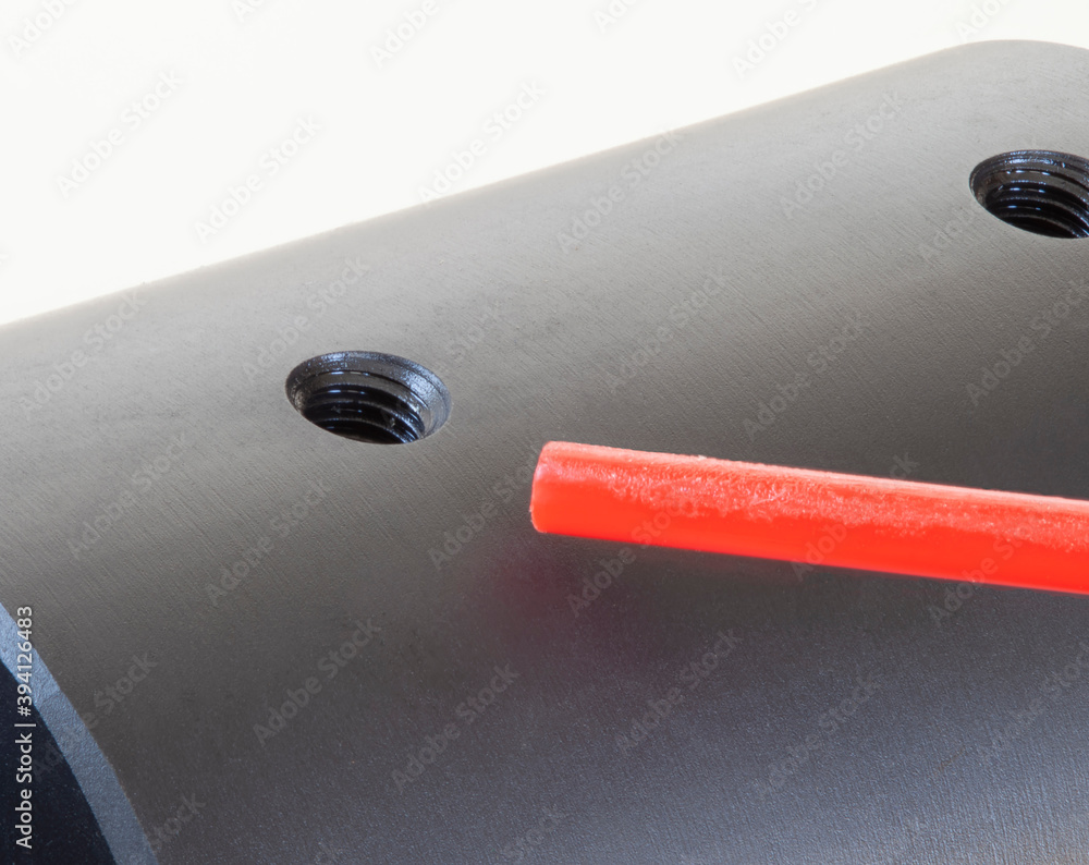 Air blowing into a bolt action rifle receiver hole for mounting a base ...