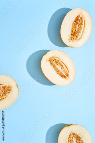 Fresh Canary Melon on a blue surface
