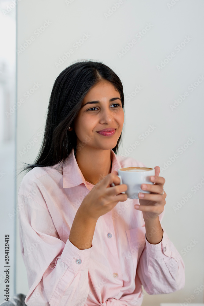 Brunette woman drinking coffee in her morning break Brunette woman drinking coffee in her morning break