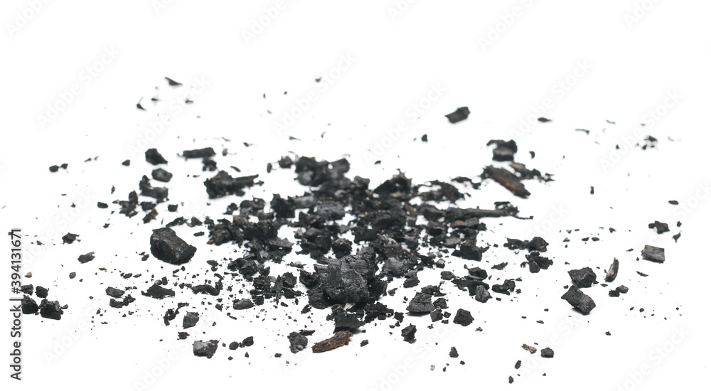 Charcoal chunks pile isolated on white background, side view