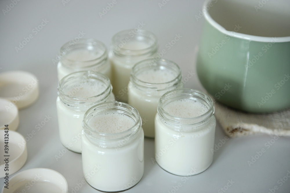Cooked milk and containers, home made Cooked milk and containers, home made
