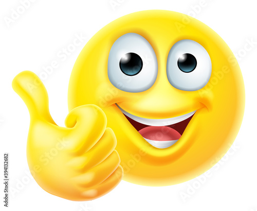 An emoji or emoticon cartoon icon face giving a thumbs up