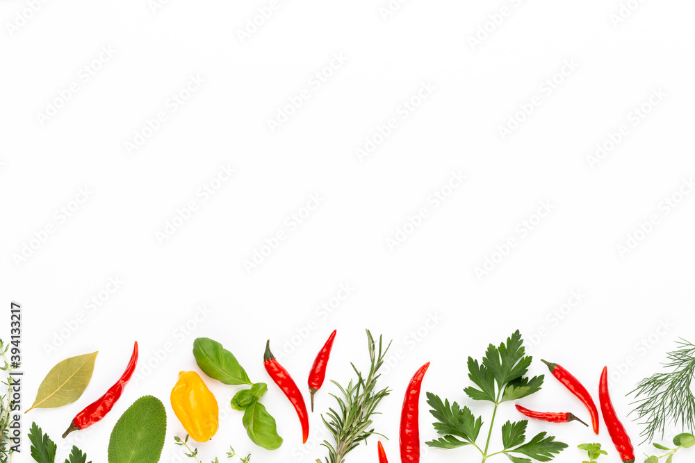 Naklejka premium Spice herbal leaves and chili pepper on white background. Vegetables pattern. Floral and vegetables on white background. Top view, flat lay.