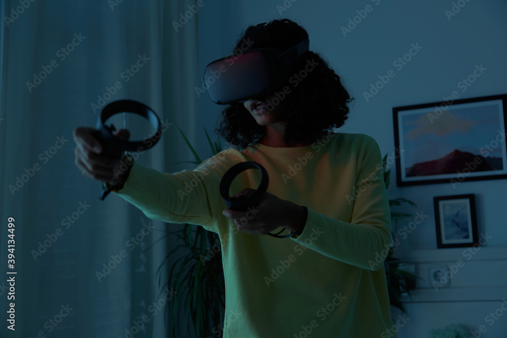 © Leandro Crespi Studio/Stocksy - VR game shooting zombies at night © Leandro Crespi Studio/Stocksy - VR game shooting zombies at night