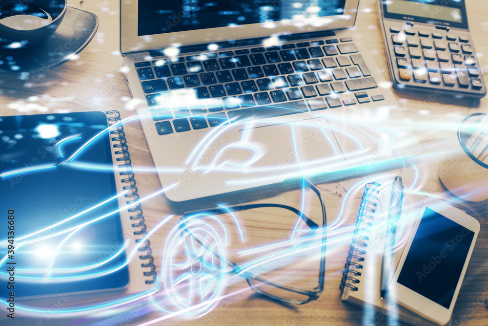 Desktop computer background in office with automobile hologram drawing. Multi exposure. Tech concept. Desktop computer background in office with automobile hologram drawing. Multi exposure. Tech concept.