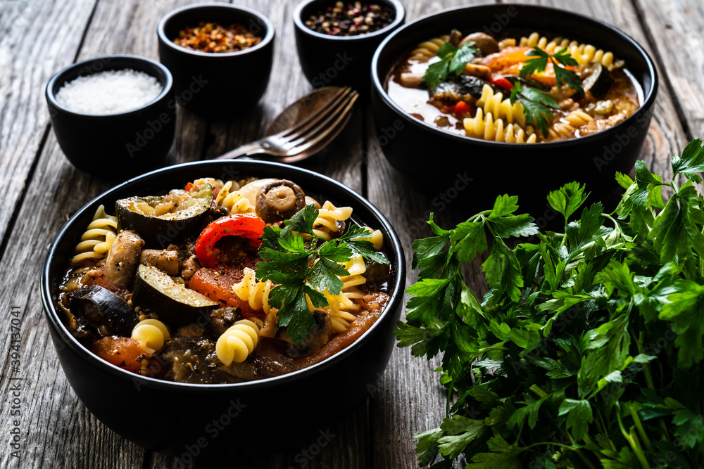 Pork ragout with fusilli and champignon on wooden table
Pork ragout with fusilli and champignon on wooden table