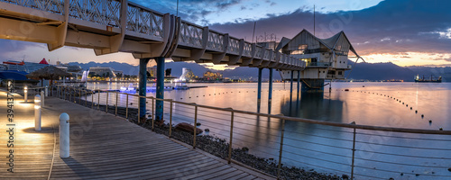 Photography Cloudy morning with walking bridge on a beach of the Red Sea, Middle East