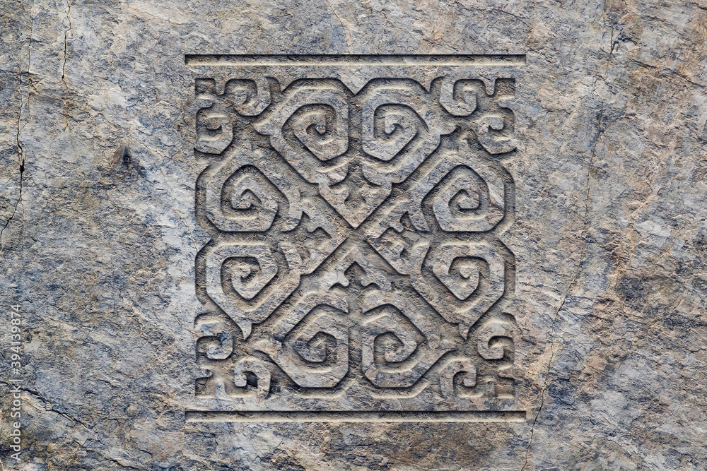 Ornamental print on the stone surface. Vintage ornament on the stone. Close-up seamless texture. Stone texture. Pattern on the stone. Embossed pattern. Wallpaper.