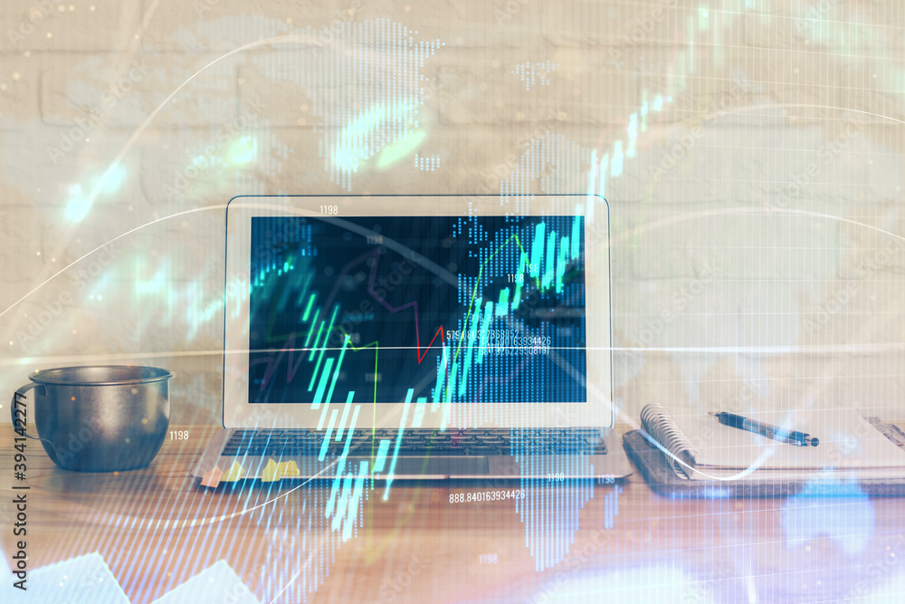 Forex market graph hologram and personal computer on background. Double exposure. Concept of investment. Forex market graph hologram and personal computer on background. Double exposure. Concept of investment.