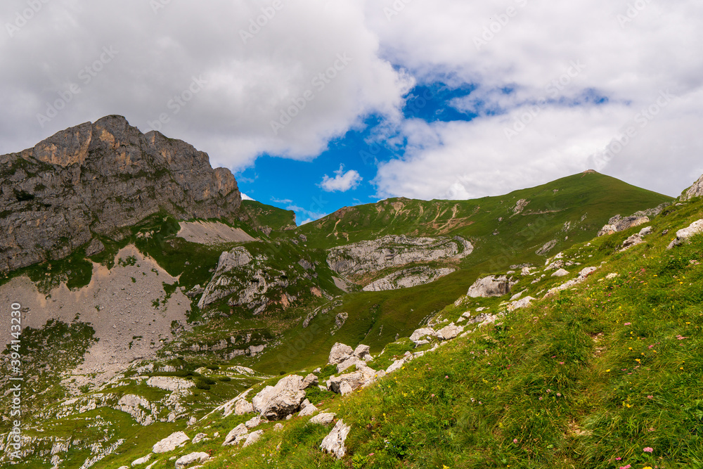 summer mountains green grass and blue sky landscape near achensee in austria, europe alps in cloudy day summer mountains green grass and blue sky landscape near achensee in austria, europe alps in cloudy day