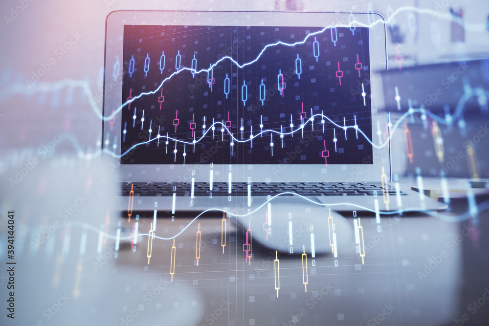 Financial market graph hologram and personal computer on background. Multi exposure. Concept of forex. Financial market graph hologram and personal computer on background. Multi exposure. Concept of forex.