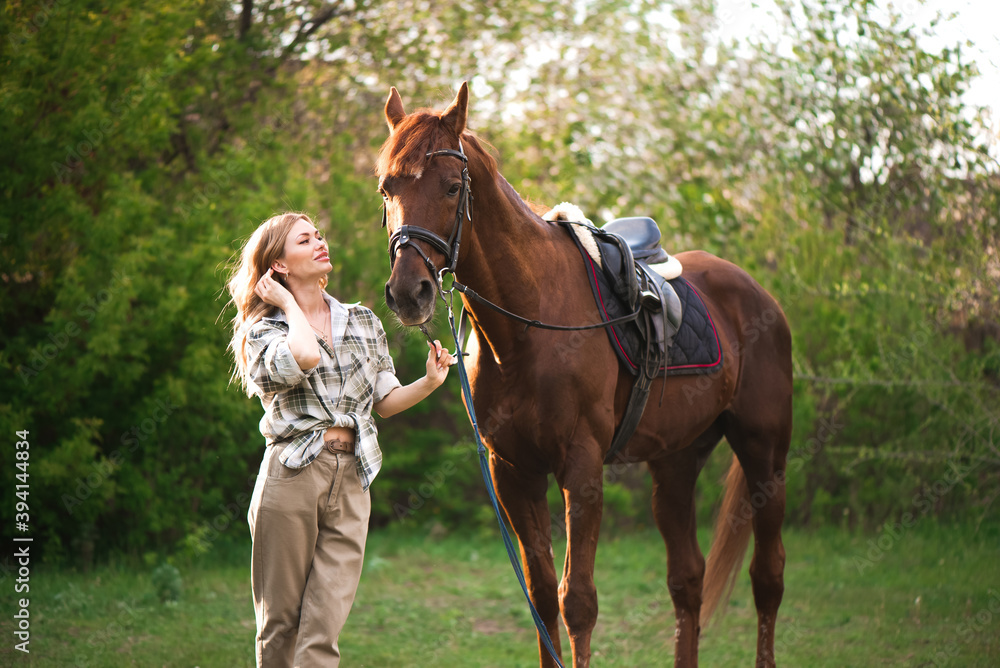 Beautiful girl with her horse and beautiful warm sunset in the spring forest. Beautiful girl with her horse and beautiful warm sunset in the spring forest.