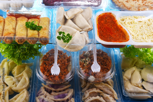 A variety of prepackaged food products in plastic boxes