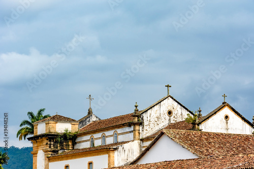 Back view of old colonial style church and roofs in the historic center of Paraty in overcast day © Fred Pinheiro