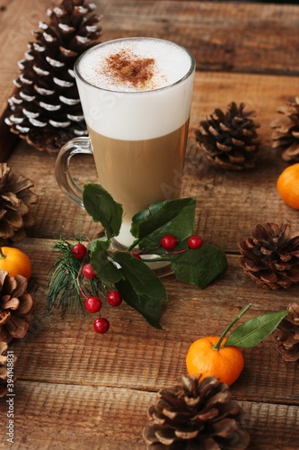 Coffee latte with cinnamon on Christmas background
