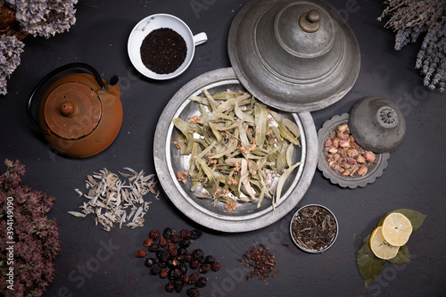 Food and drink, still life concept. Selection assortment of different japanese chinese herbal masala tea infusion beverage teapot with flowers on the table.