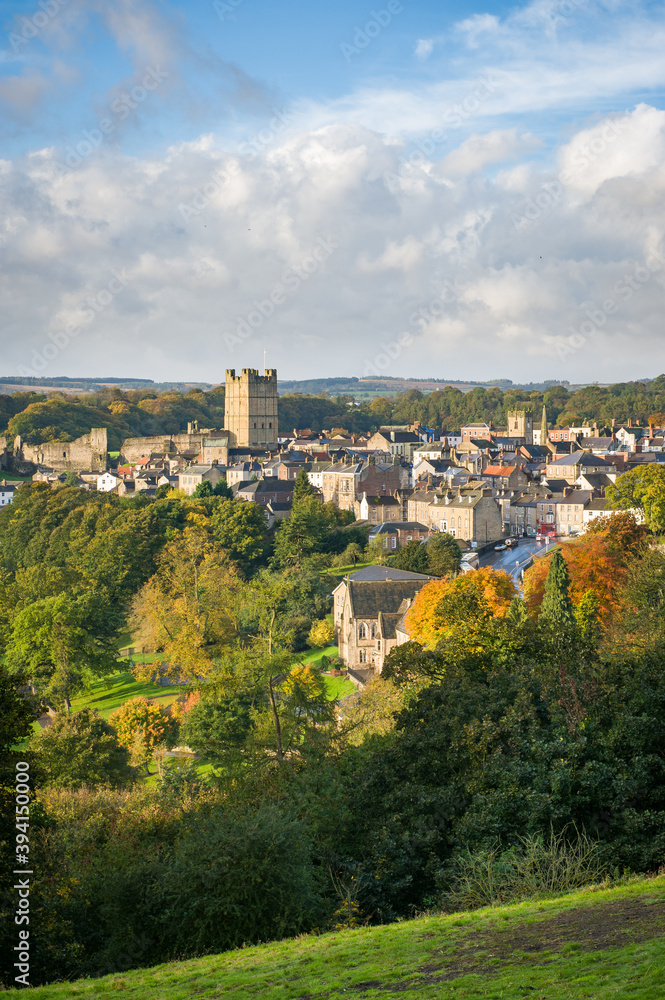 Tall view of Richmond, North Yorkshire and the castle with autumn colours in the foreground