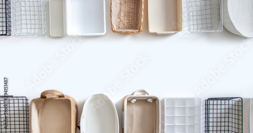 Top view of closet organization boxes and steel wire baskets in different shapes. photo