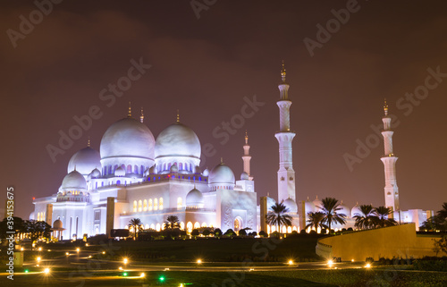 Night view of domes of Grand Mosque in Abu Dhabi, UAE, also called Sheikh Zayed Grand Mosque, inspired by Persian, Mughal and Moorish mosque architecture