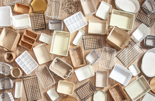 Flat lay of Marie Kondo's storage boxes, containers and baskets with different sizes and shapes photo