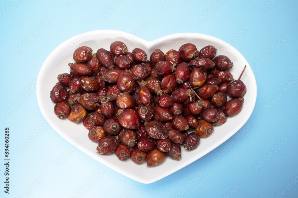Dried Rosehips are in heart shaped bow Dried Rosehips are in heart shaped bow