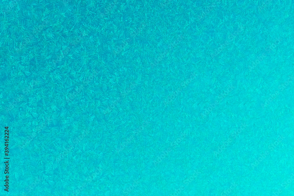 cyanic frost on a glass background. texture patterned frosted glass. cyanic frost on a glass background. texture patterned frosted glass.