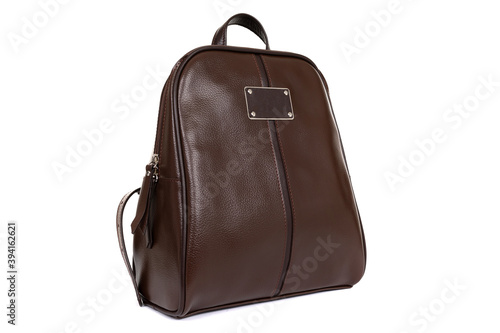 brown handbag made of genuine leather close up on a white background