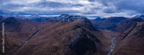 aerial view of glen etive in winter near glencoe in the argyll region of the highlands of scotland showing snow dusting on the mountains and munros
 photo