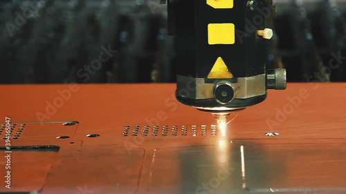 CNC Laser cutting of flat sheet metal steel material.  Industrial machine CNC plasma laser