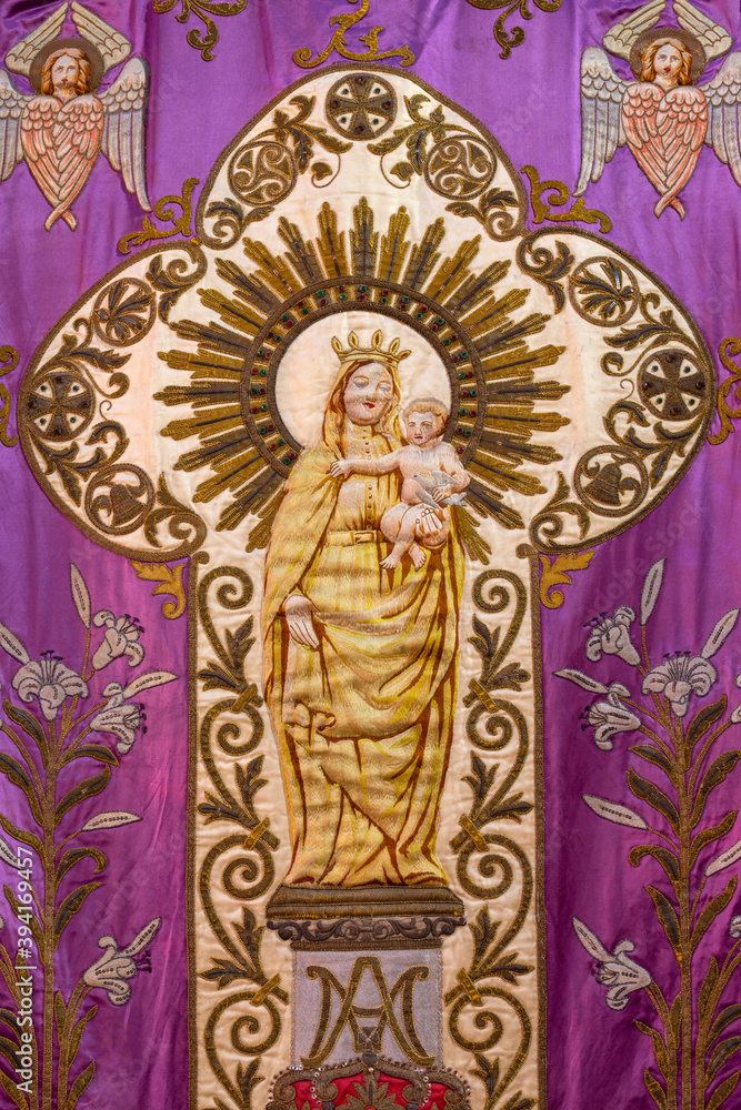 ZARAGOZA, SPAIN - MARCH 3, 2018: The  Madonna on the old flag in former church Iglesia del Sagrado Corazon de Jesus.