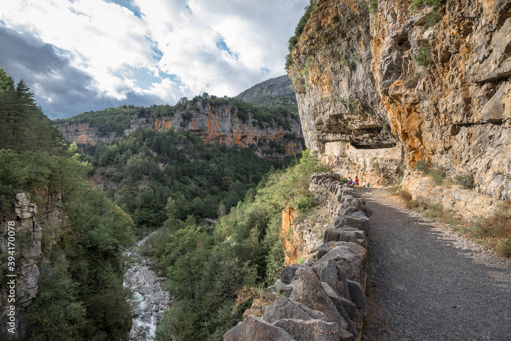 View of the canyon bottom from the inner dirt road of Anisclo Canyon, located south of Monte Perdido, in Ordessa and Monte Perdido National Park, town of Escaluna, Pyrenees, Spain.