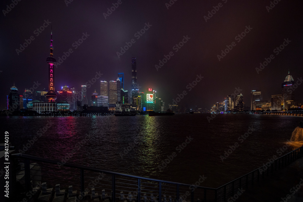A night view of the modern Pudong skyline across the Bund in Shanghai, China. Shanghai is the largest Chinese city.