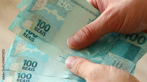 Brazilian money, called Reais, Counting and shifting banknotes high value banknotes
