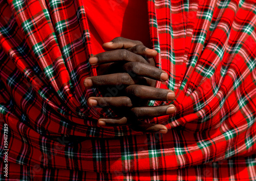 Maasai tribe man hands crossed, Rift Valley Province, Maasai Mara, Kenya photo