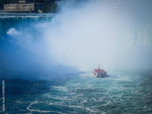 Niagara Falls, Canada, Sept 2019, view of a Hornblower Niagara Falls boat tour in the Horseshoe Falls mist photo