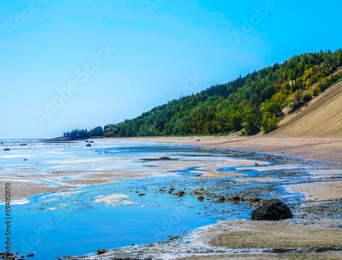 Saint Lawrence river shore by the 
Sand dunes of Tadoussac in Quebec, Canada