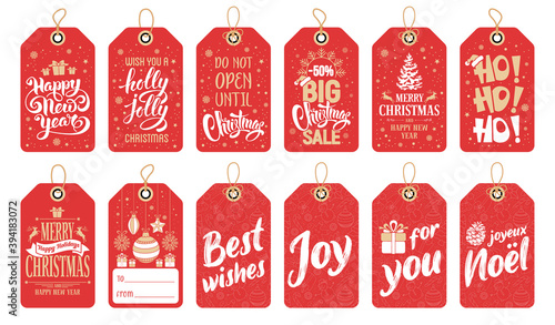 Festive gift tags set for Christmas and New Year celebration. Decorated with calligraphy lettering and holiday graphic elements. Vector illustration.
