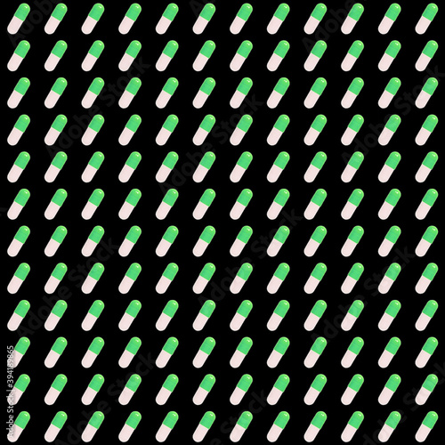 pattern of green pills on a black background