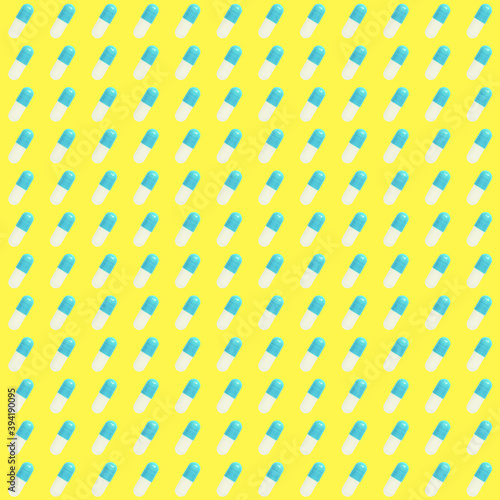 pattern of blue pills on a yellow background