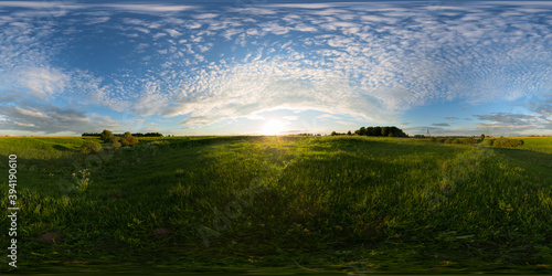 Sunset on meadow spherical 360 degree panorama photo