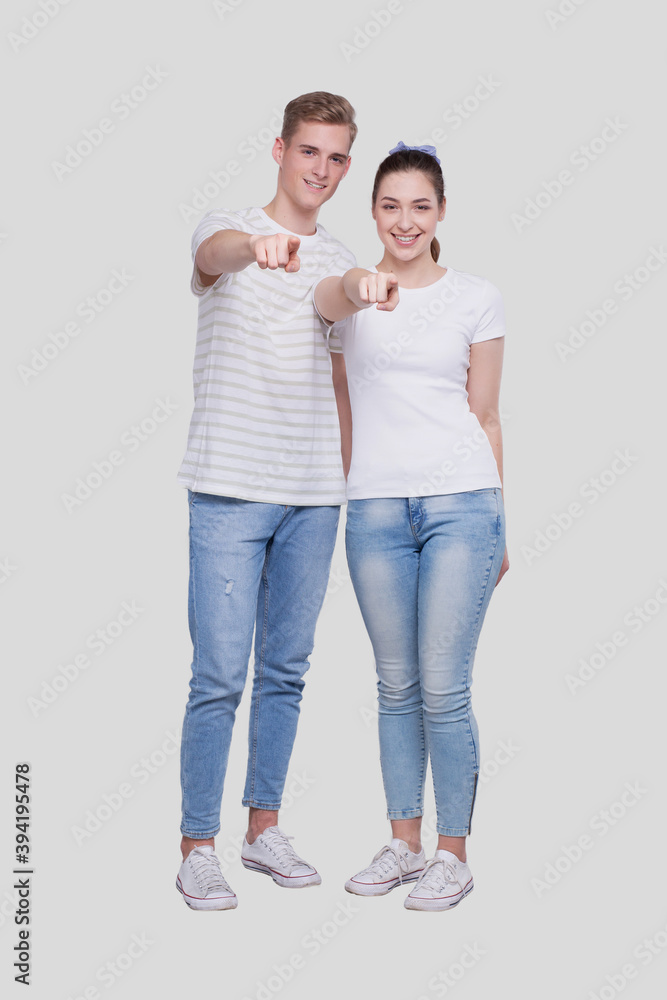 Couple Pointing to Camera Standing Isolated. Man and Woman Pointing, Lovers, Friends, Couple Concept Couple Pointing to Camera Standing Isolated. Man and Woman Pointing, Lovers, Friends, Couple Concept