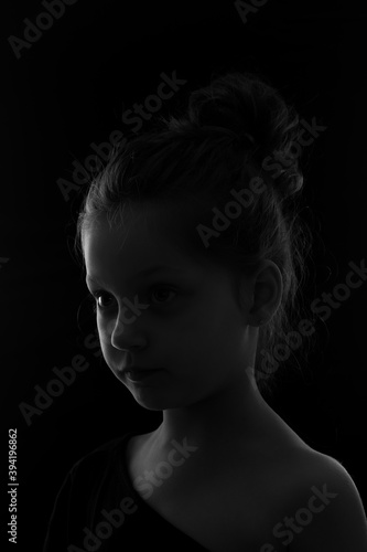 chiaroscuro portrait of a cute little girl