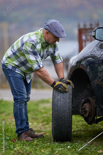 Man changing a flat tyre