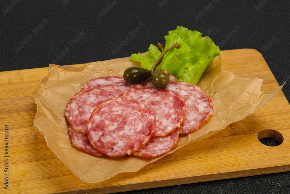 Spanish Salchichon sausage with salad Spanish Salchichon sausage with salad