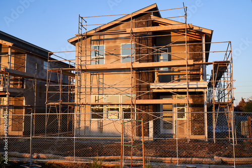New home construction with exterior scaffolding; single family homes under construction in Chico California 