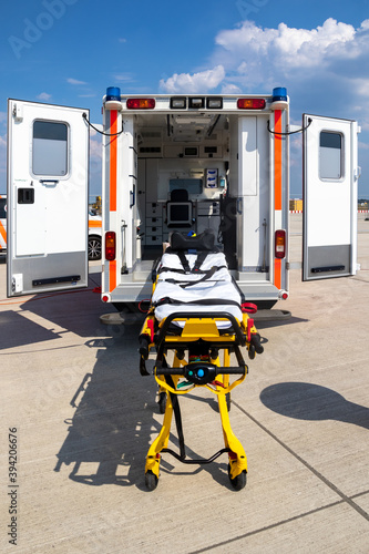 Emergency stretcher and EMS ambulance with open door